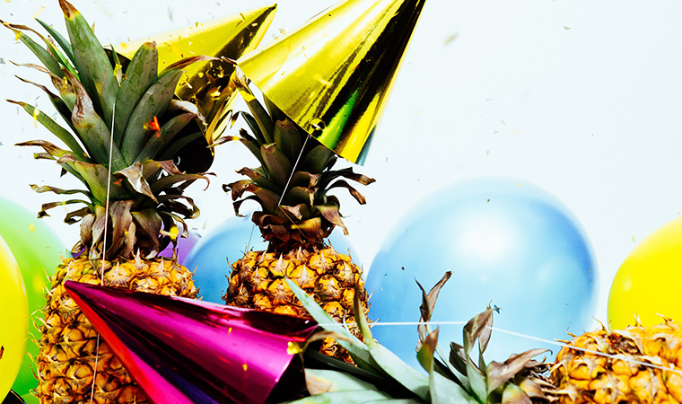 Pineapples in party hats.