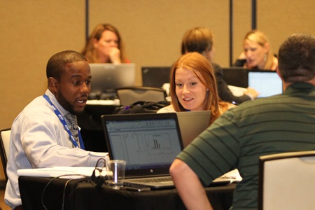 ICMI contact center training symposium attendees networking and collaborating