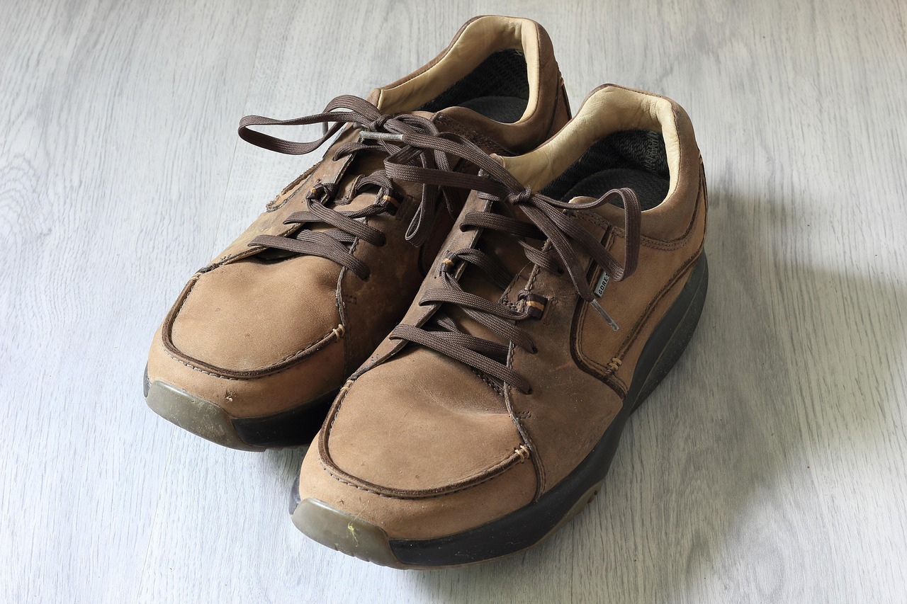 a pair of laced up brown men's shoes