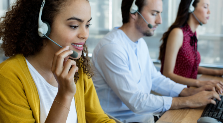 Graphic featuring three contact center agents.