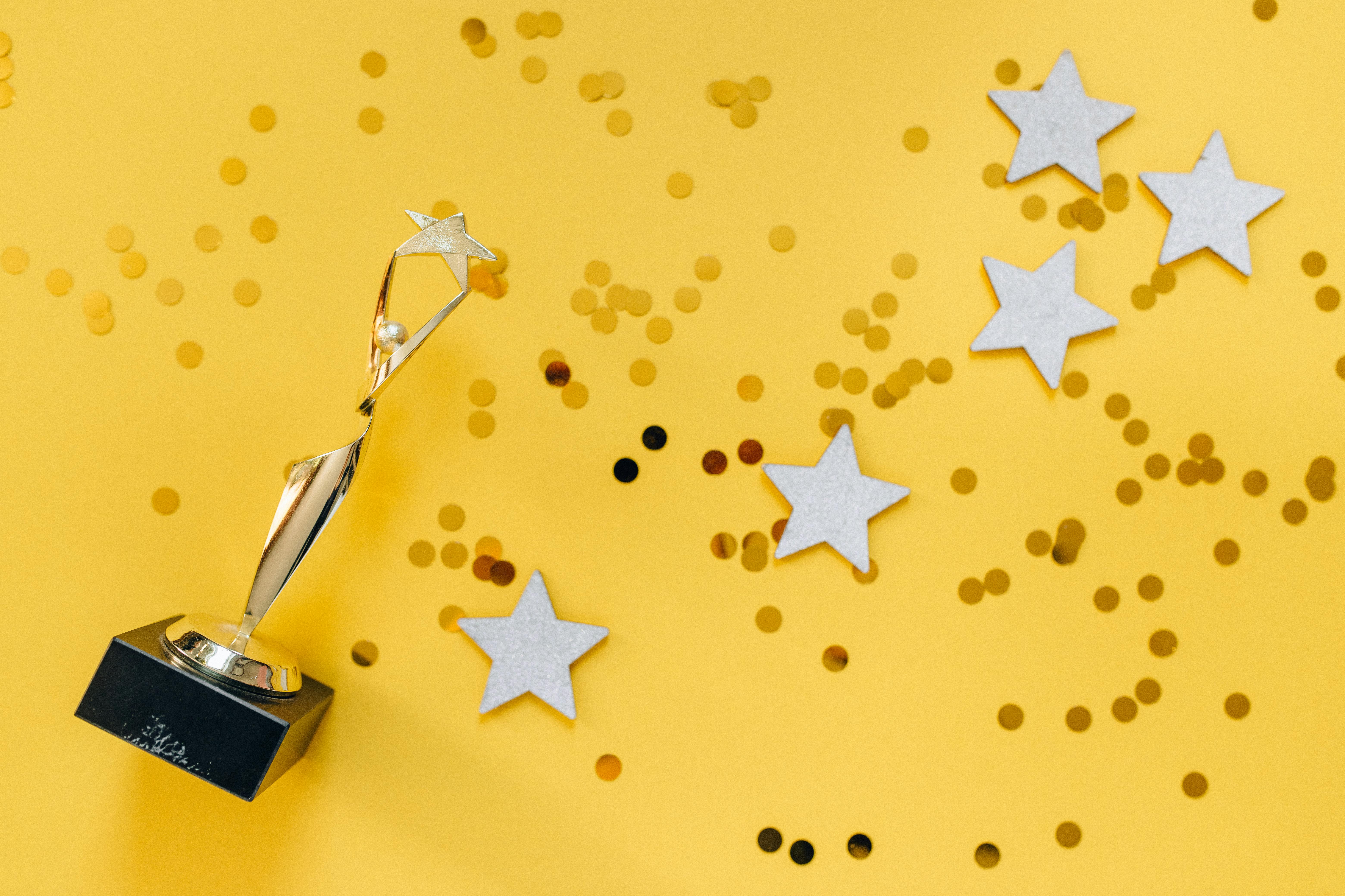 gold trophy on yellow background - ICMI Awards finalists