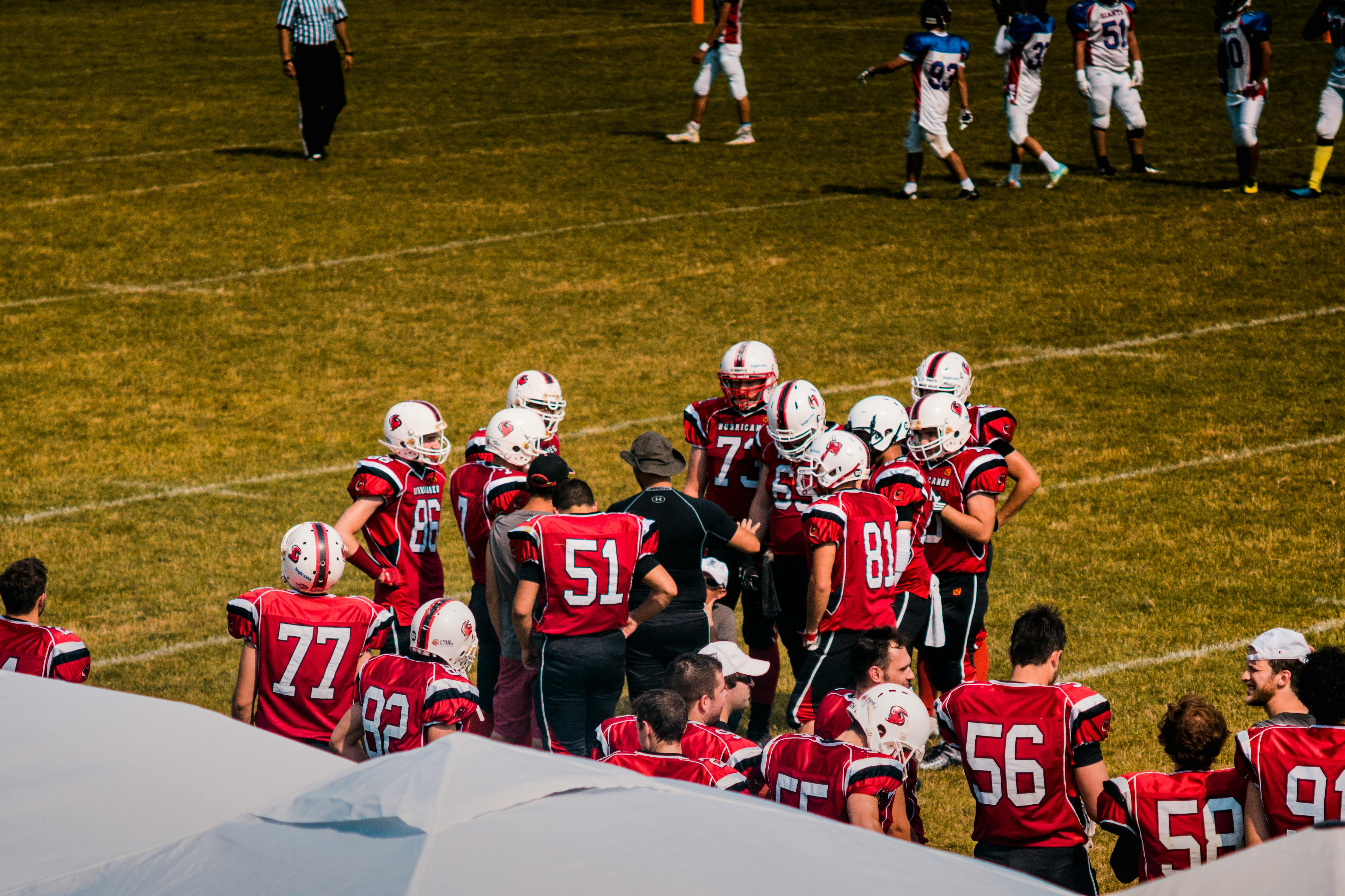 football team in a huddle