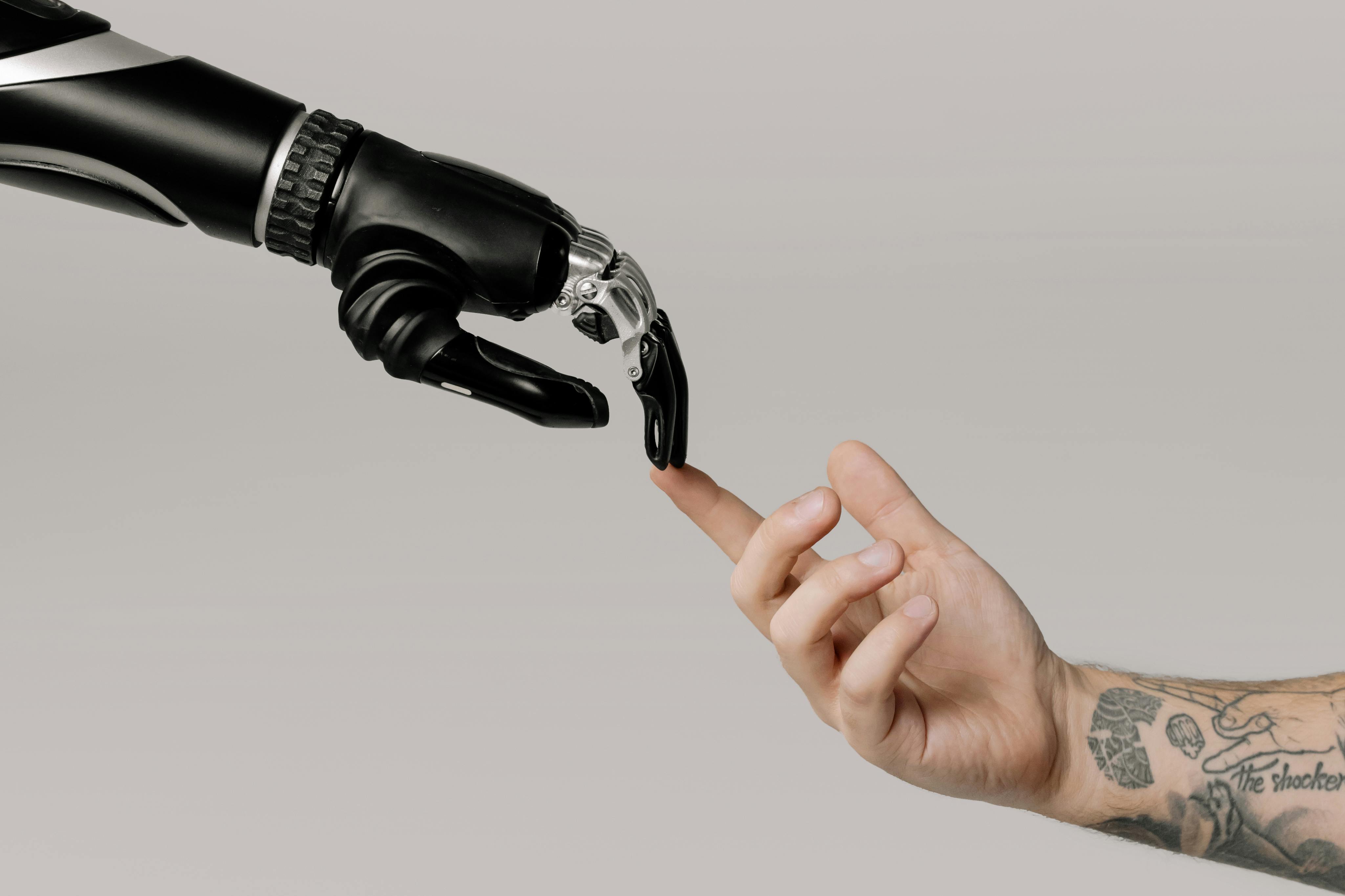 human finger touching AI robot finger