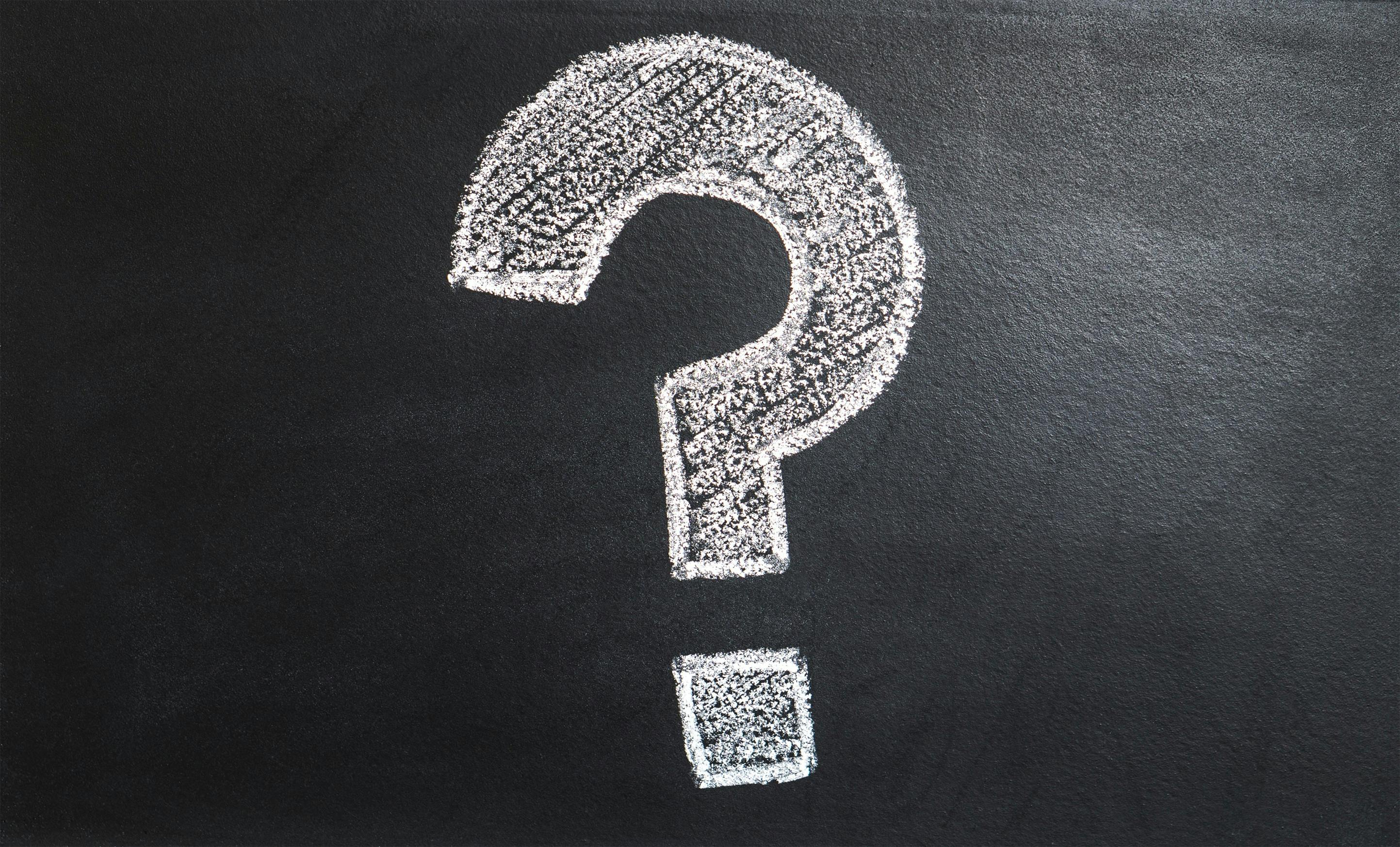 question mark on a black chalkboard