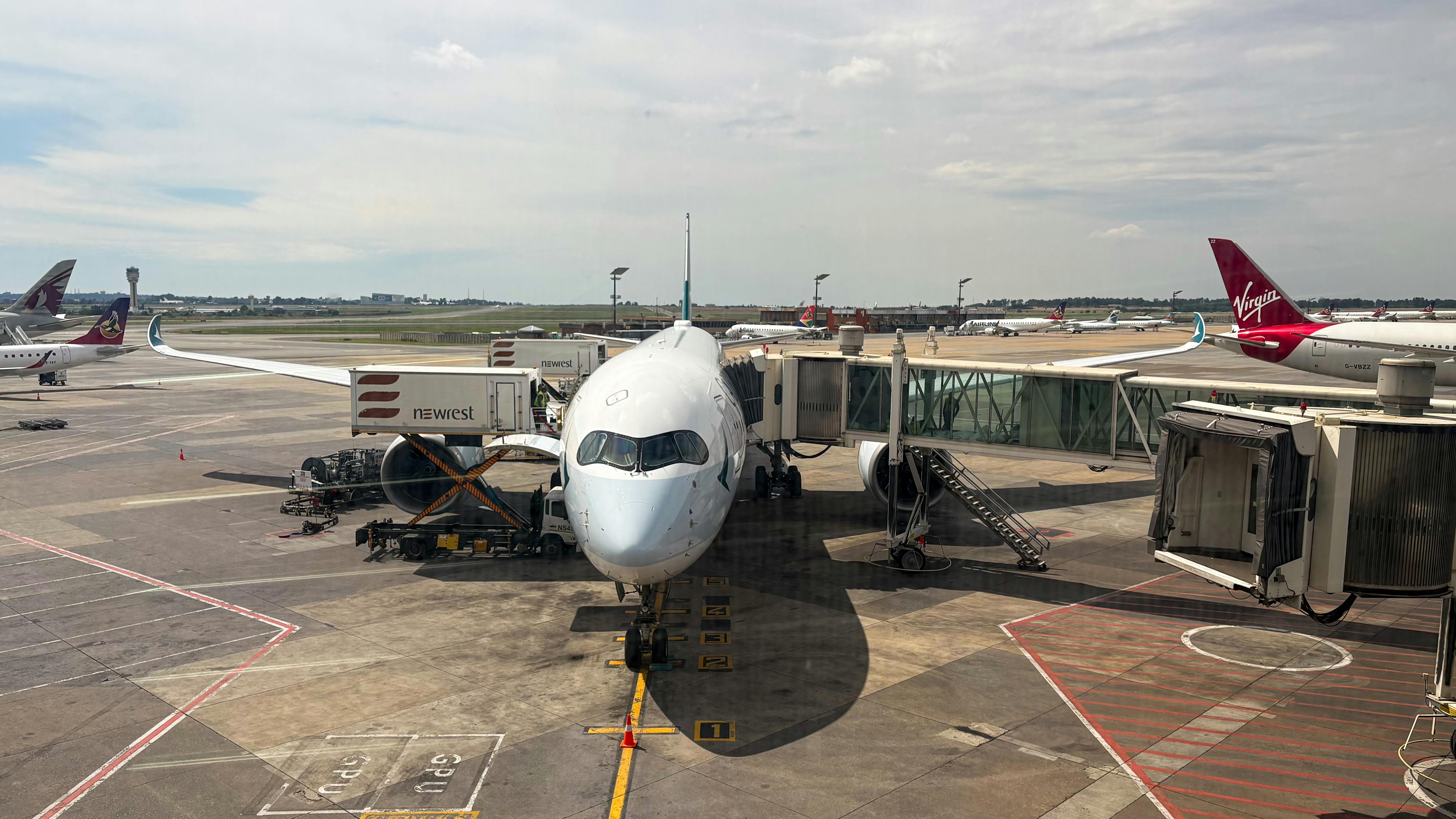 Modern aircraft at a busy airport terminal, representing customer experience and service culture in the airline industry.